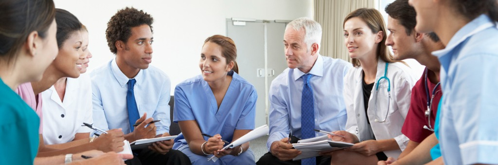 Healthcare team in discussion meeting.