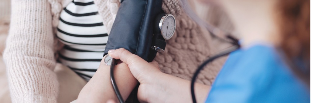Taking blood pressure reading.