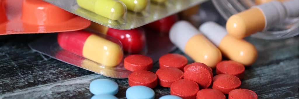 Assorted colourful pills and capsules.